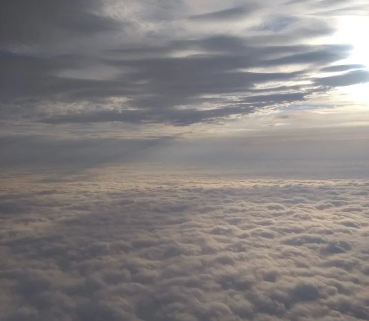 Above the clouds at sunset